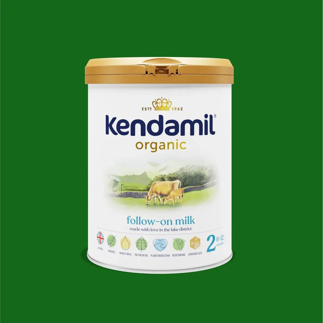 A canister of Kendamil Organic Follow-on Milk, size 2, featuring a white label with a gold lid, set against a solid green background.