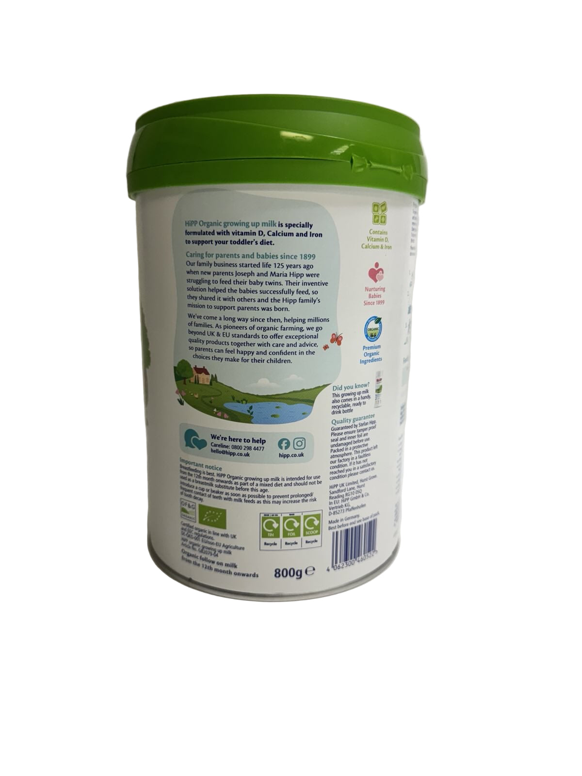 Container with a green lid and white label on a light gray background