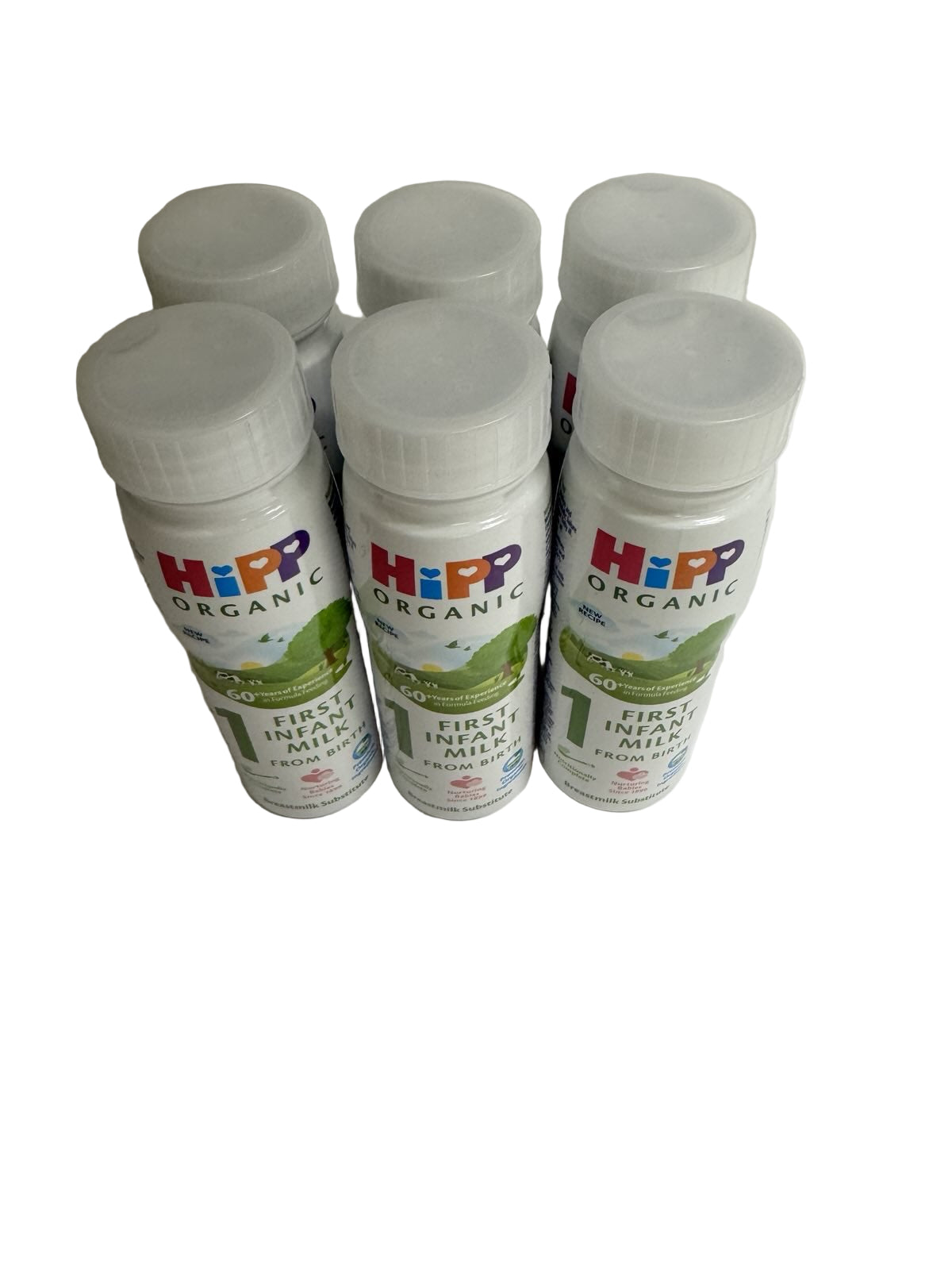 Six Hipp Organic First Infant Ready to Feed Milk bottle on a plain background