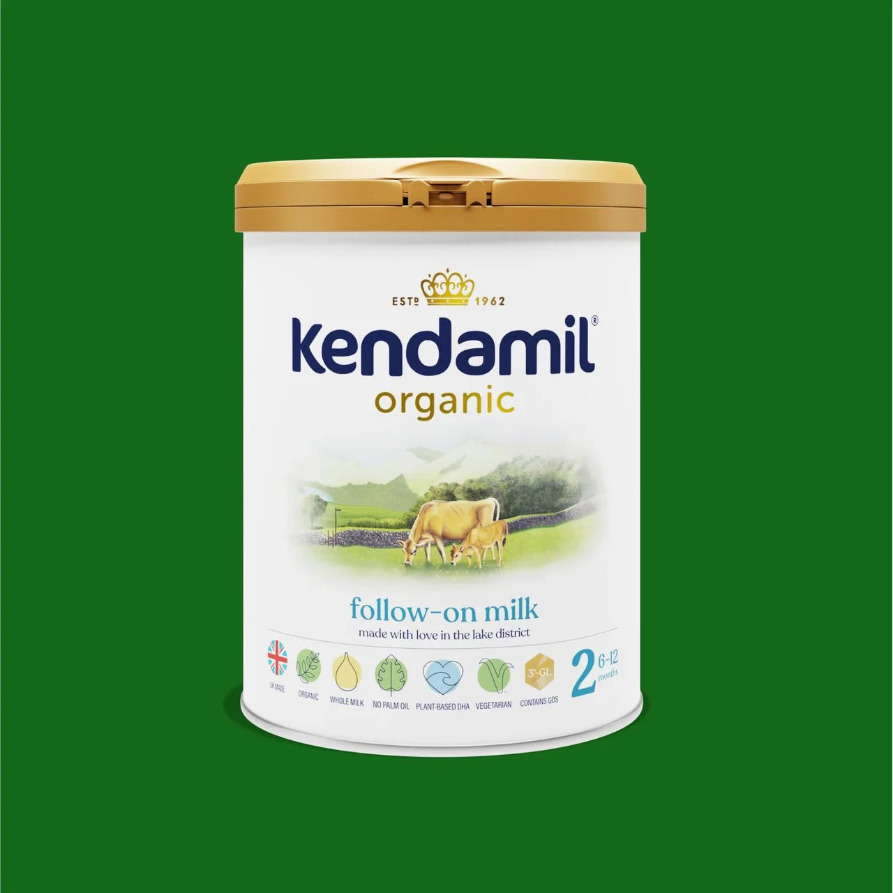 A canister of Kendamil Organic Follow-on Milk, size 2, featuring a white label with a gold lid, set against a solid green background.