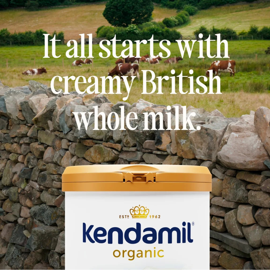 Kendamil organic milk container with a scenic background of cows in a field.