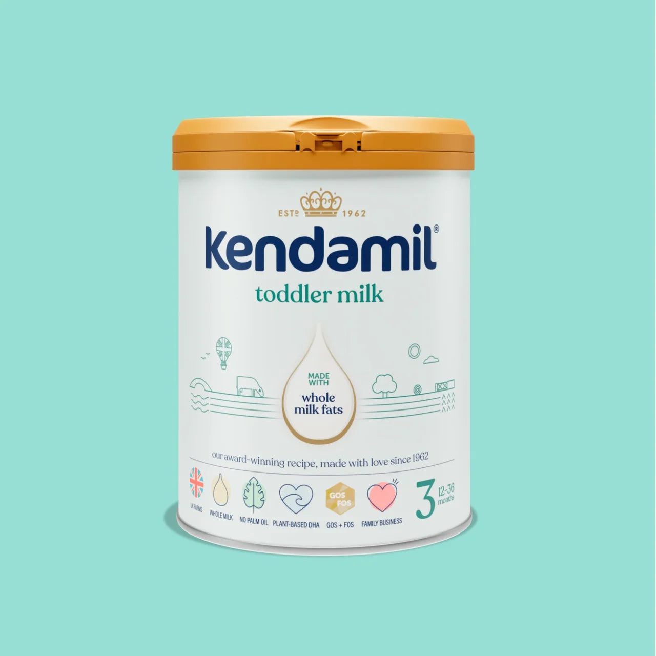 A canister of Kendamil toddler milk powder on a solid light teal background. The canister is white with a mustard yellow lid and features the brand name 'Kendamil' in blue, along with 'toddler milk' and 'whole milk fats' text.
