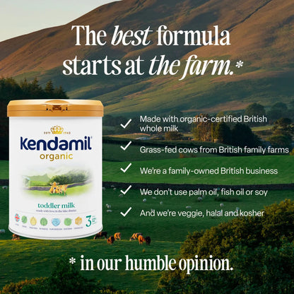 Kendamil organic toddler milk container with a scenic farm background