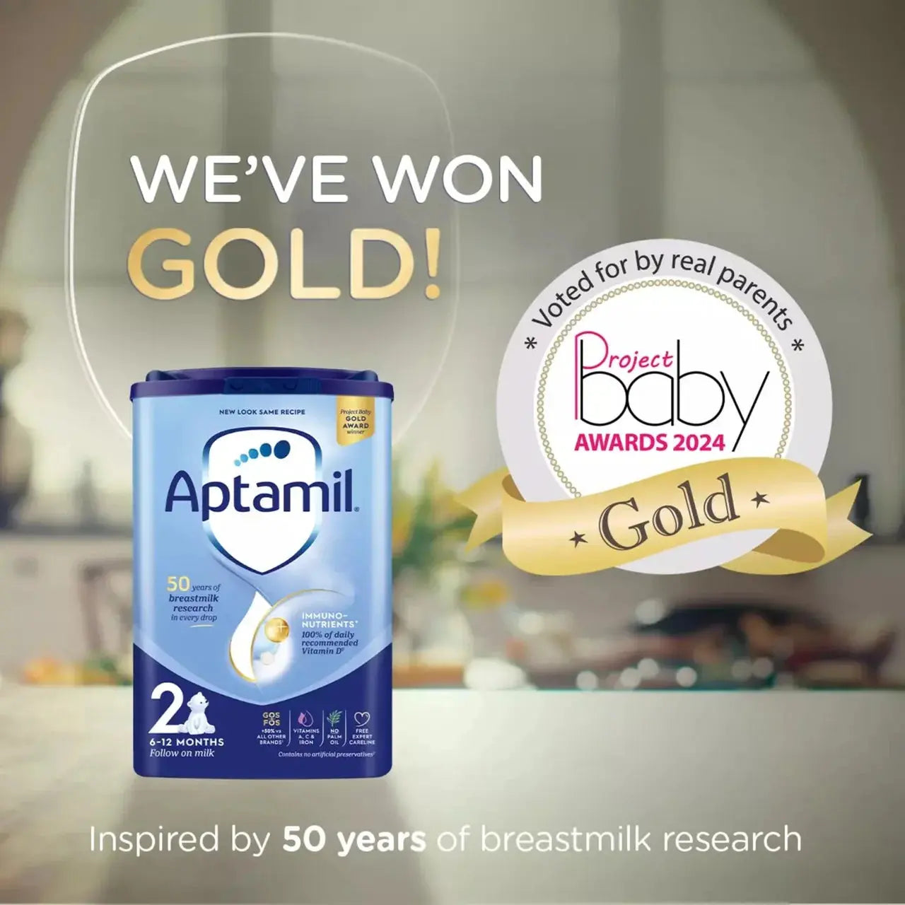 Aptamil baby formula packaging with Project Baby Awards 2024 Gold badge on a blurred background