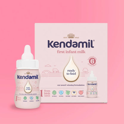 Kendamil bottle and packaging on a pink background