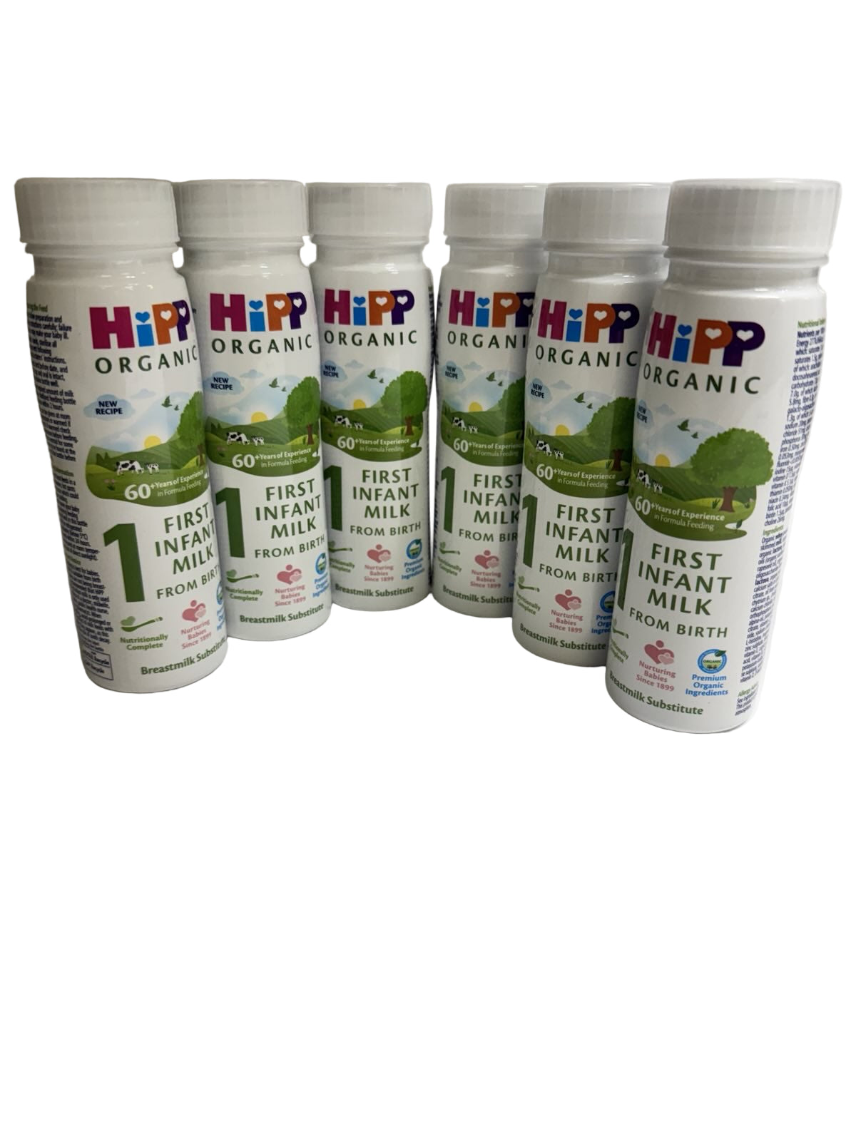 Six Hipp Organic First Infant Ready to Feed Milk bottles on a plain background